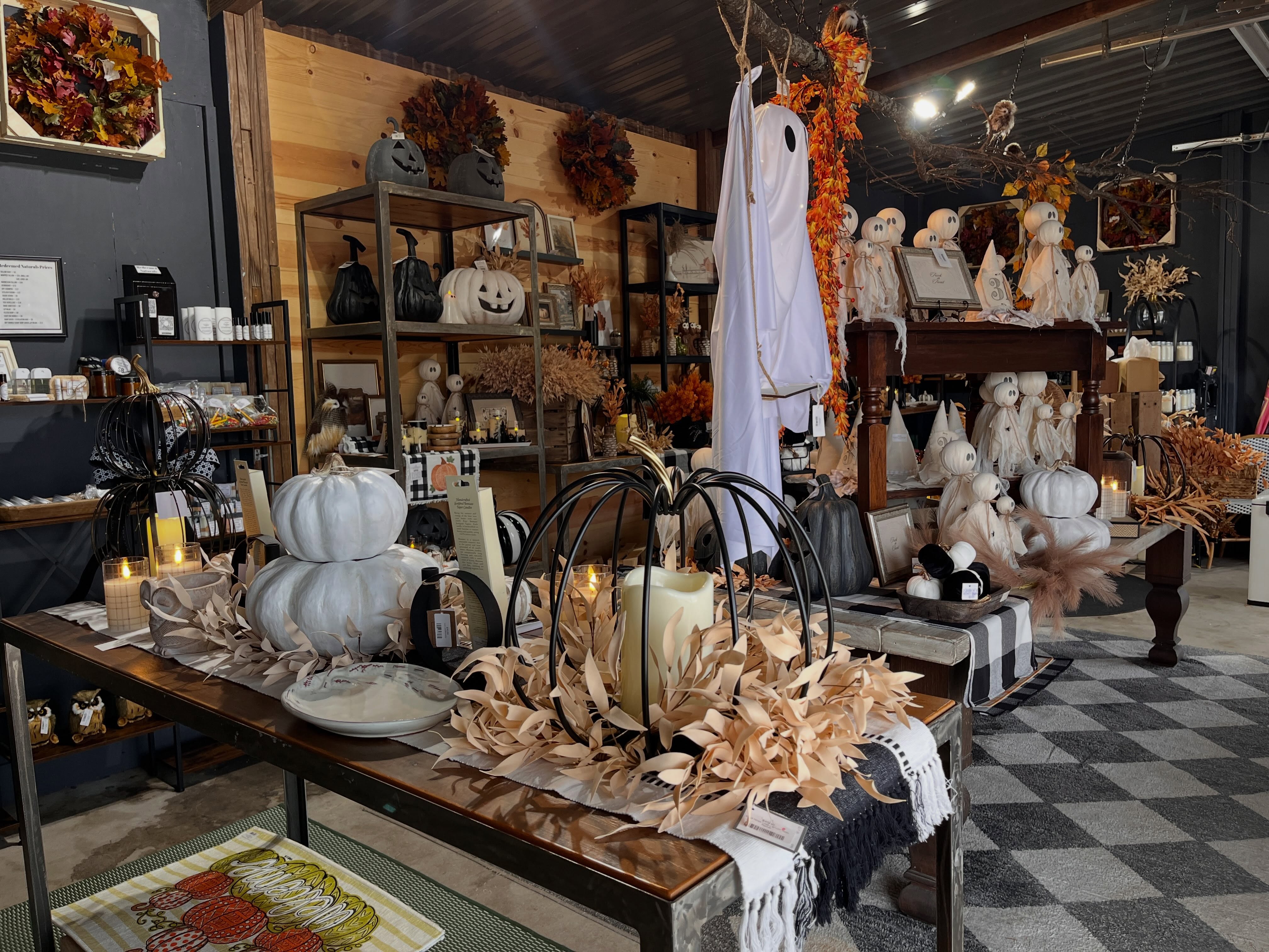 Fall decor display inside Millie's Filling Station, pumpkins and ghosts